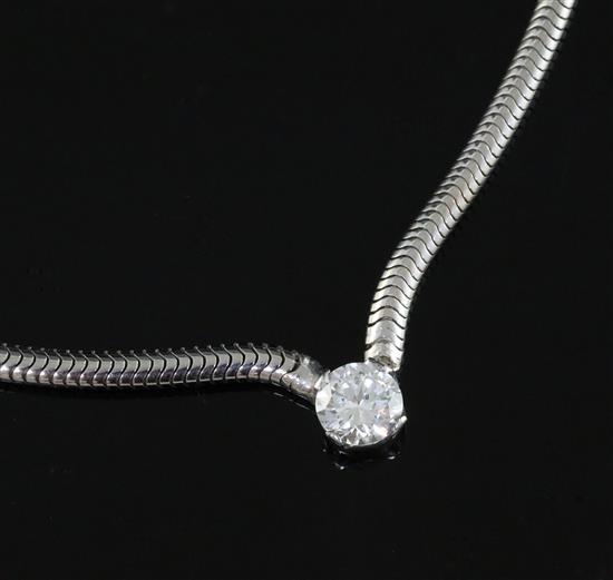 A white metal and single stone diamond set chain and snakelink, choker necklace, 40cm.